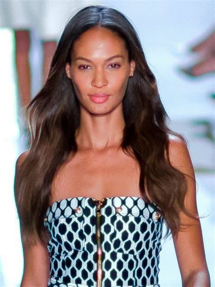 Loved-up:&nbsp;Joan Smalls, 32, and her boyfriend Henry Junior Chalhoub, 35, put on a cosy display on Monday, when the loved-up duo was spotted embracing on a luxury boat in St Tropez